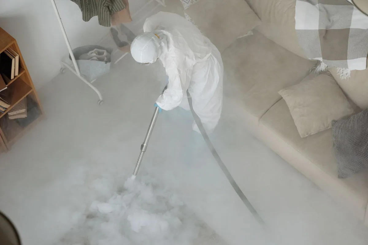 Biohazard cleanup technician in protective equipment, Bonton, Dallas, TX